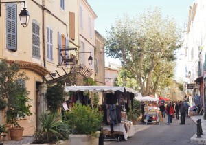 Main street of La Cadiere d'Azur with the entrance to the Hostellerie Berard at left
